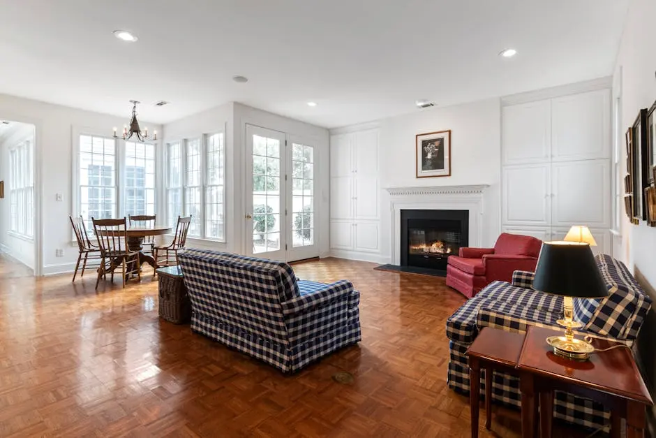 A bright, spacious living room with elegant furniture and a cozy fireplace, ideal for modern home design inspiration.