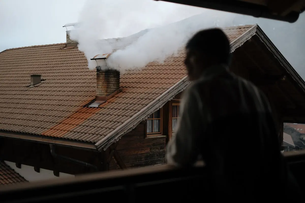 Chimney Smoke behind Standing Man