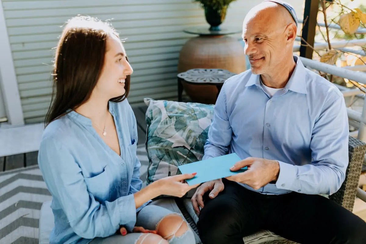 Photo Of People Seated On Couch