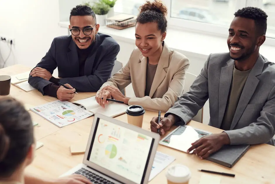 A diverse team of professionals having a meeting in a modern office setting, discussing business strategies.