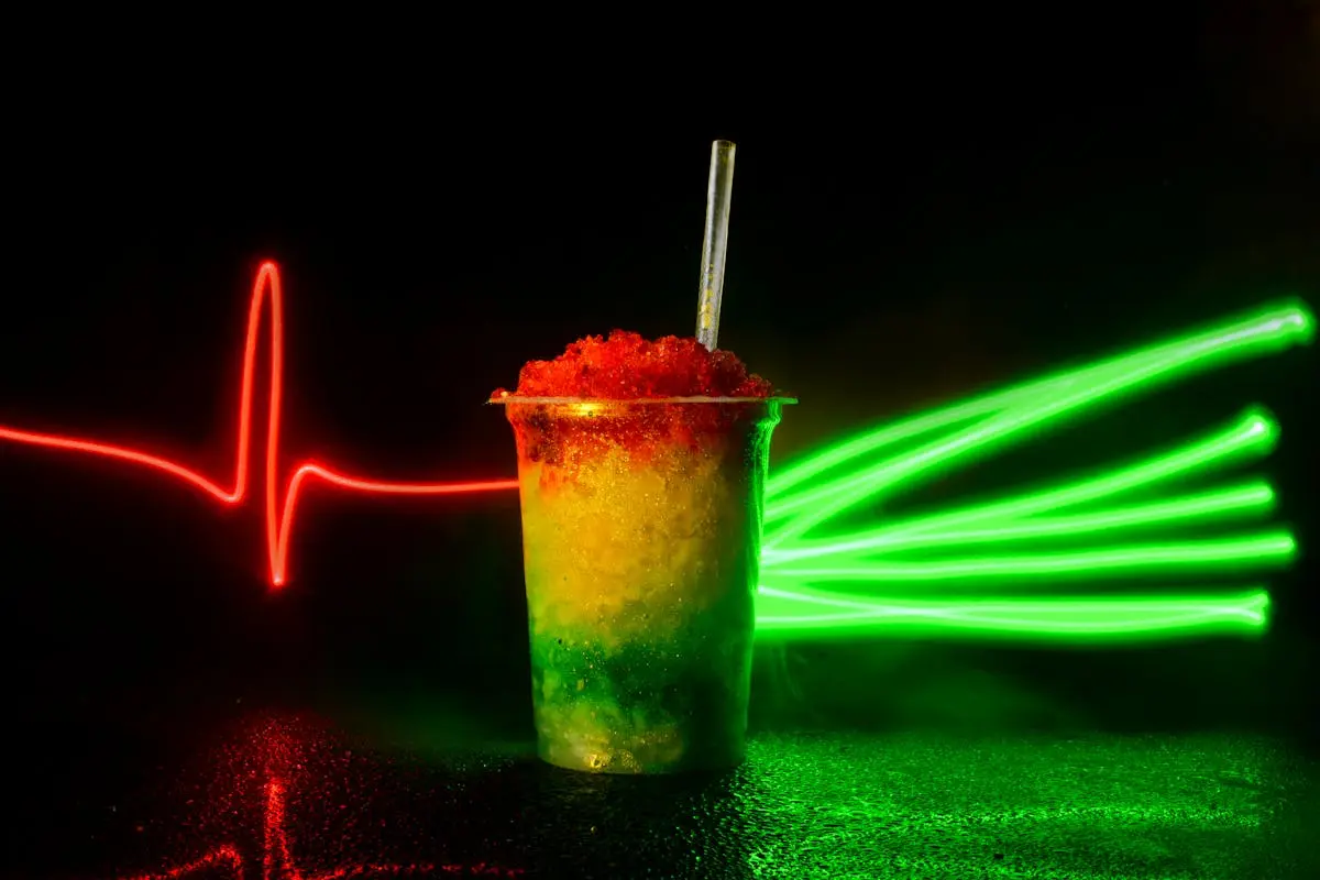 A Tricolor Snow Cone Cup on the Background of Neon Lights 