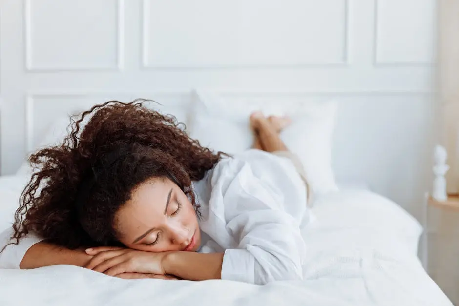 Photo of Woman Lying on Bed