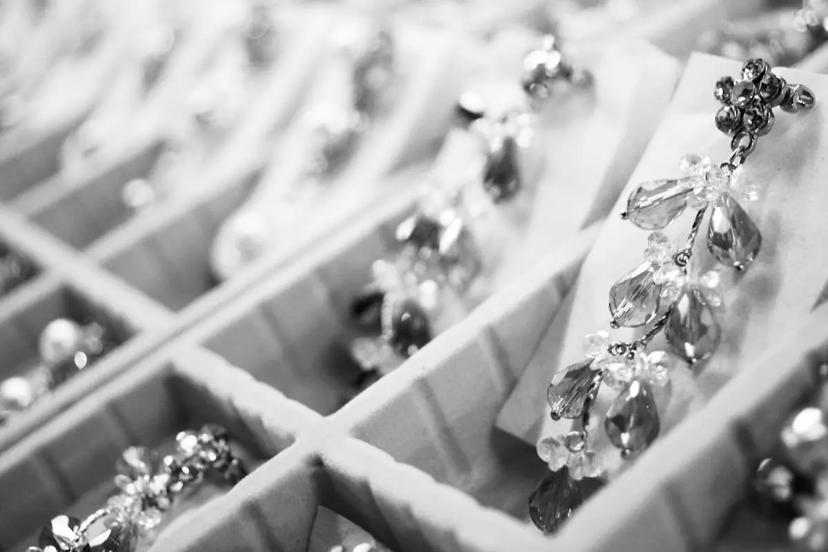 Close-up of elegant crystal earrings in a display box highlighting intricate jewelry details. elegant jewelry