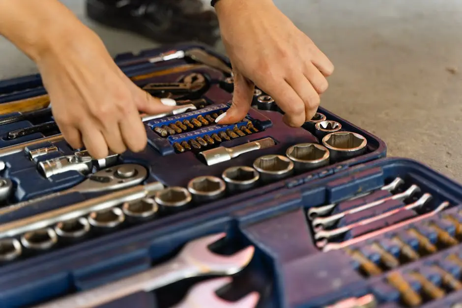 A Person Touching Tools in a Box