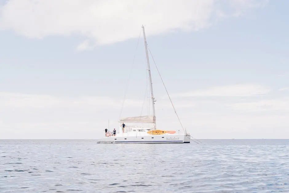 White Boat On Sea Under White Sky