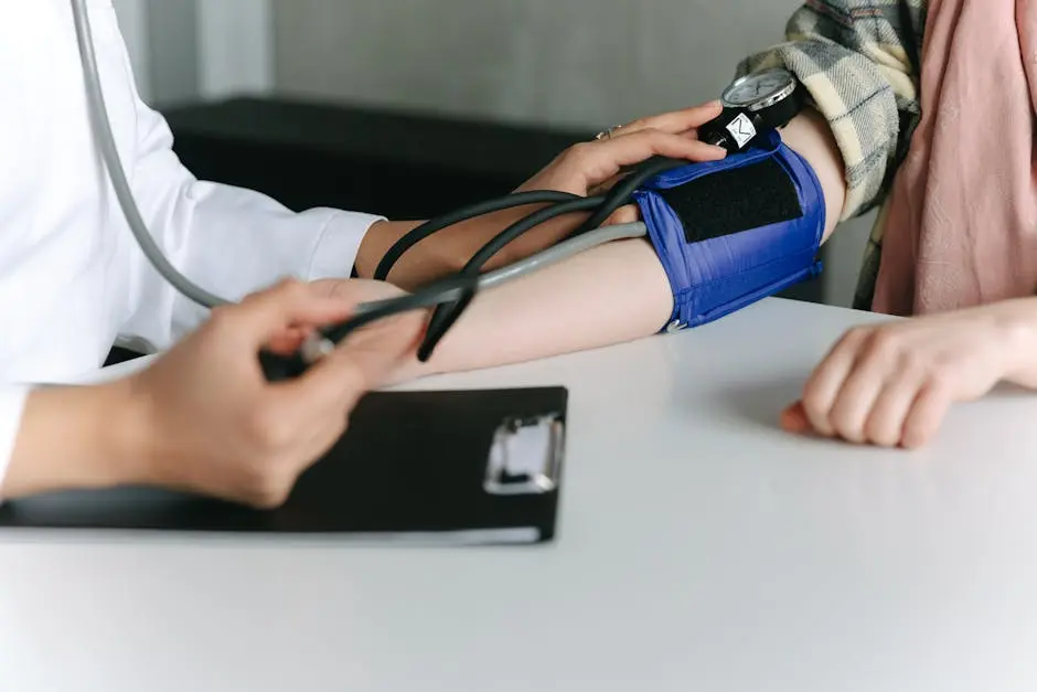 A Healthcare Worker Measuring a Patient’s Blood Pressure Using a Sphygmomanometer