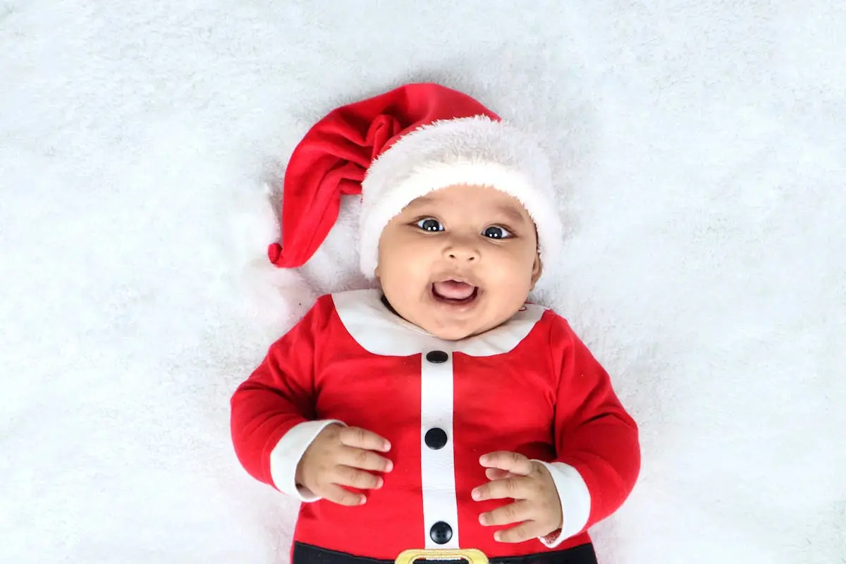 Photo of a Newborn Wearing a Santa Claus Costume