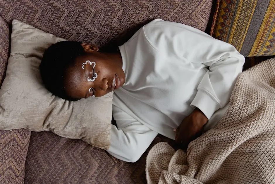 Woman Sleeping on the Sofa with Pillow and Blanket