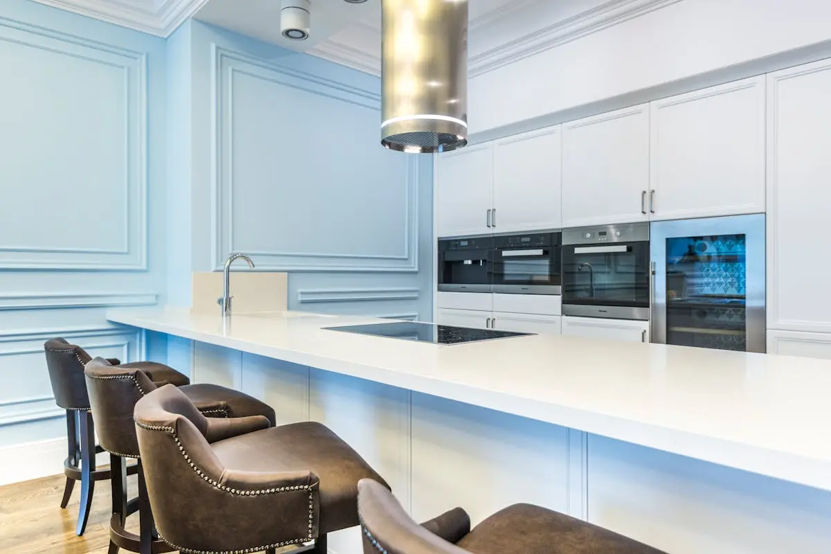 Minimal Kitchen Interior Design with Leather Chairs on Counter