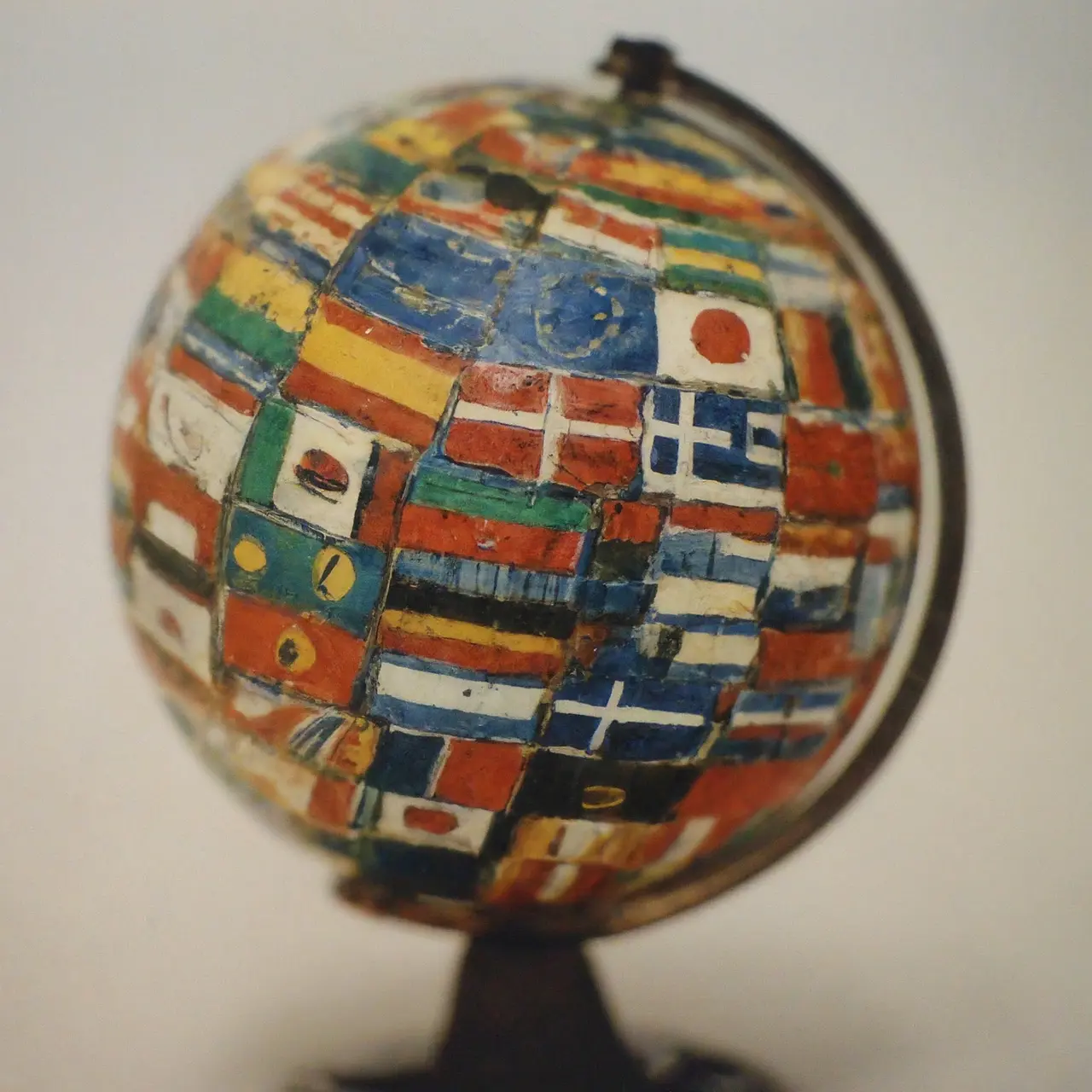 A globe with various flags and educational icons surrounding it. 35mm stock photo