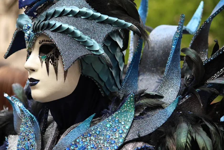 A person in a mask with feathers and blue makeup