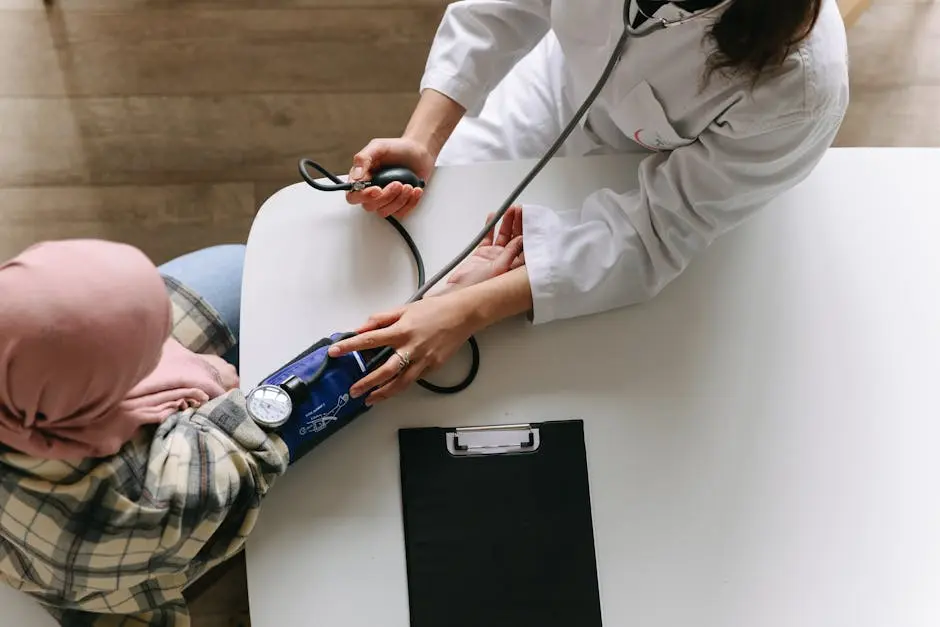 A Doctor Taking Patient’s Blood Pressure