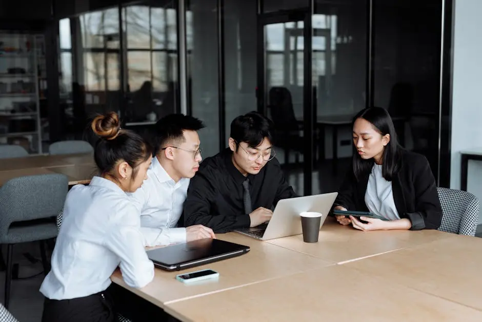 Business People Looking at the Laptop