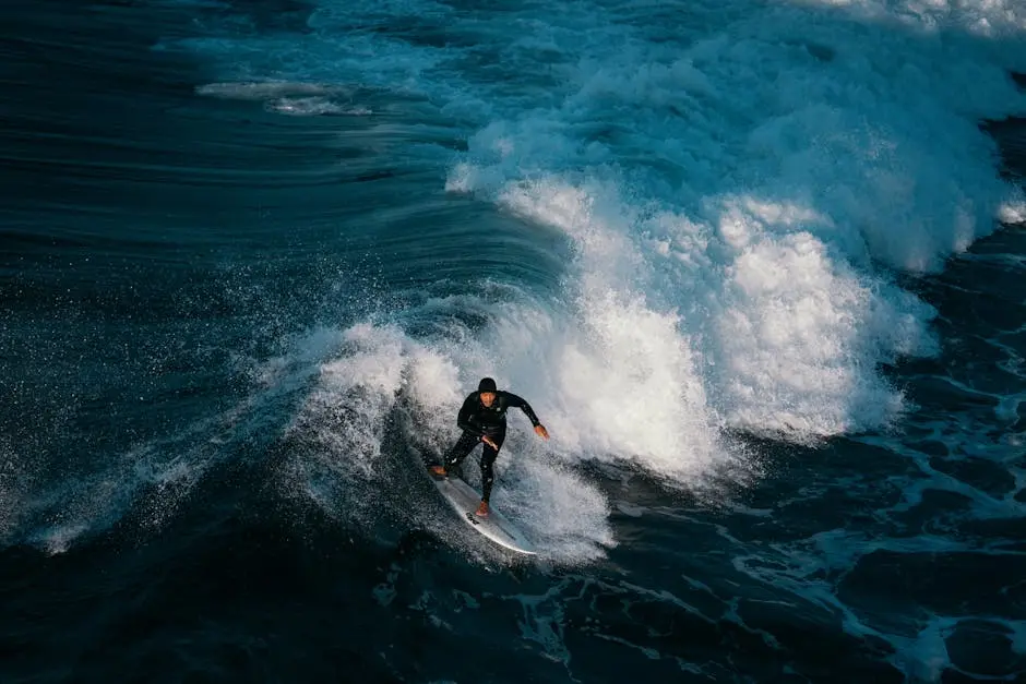 Birds Eye View of a Man Surfing on the Sea Water