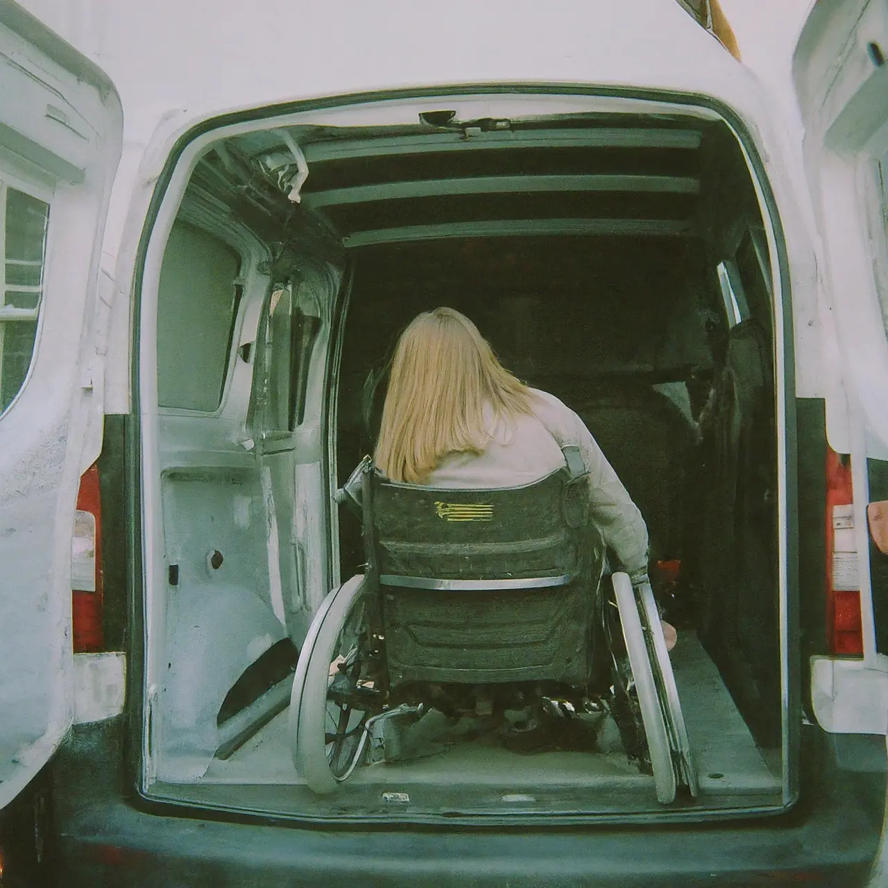 Wheelchair being loaded into an accessible van. 35mm stock photo