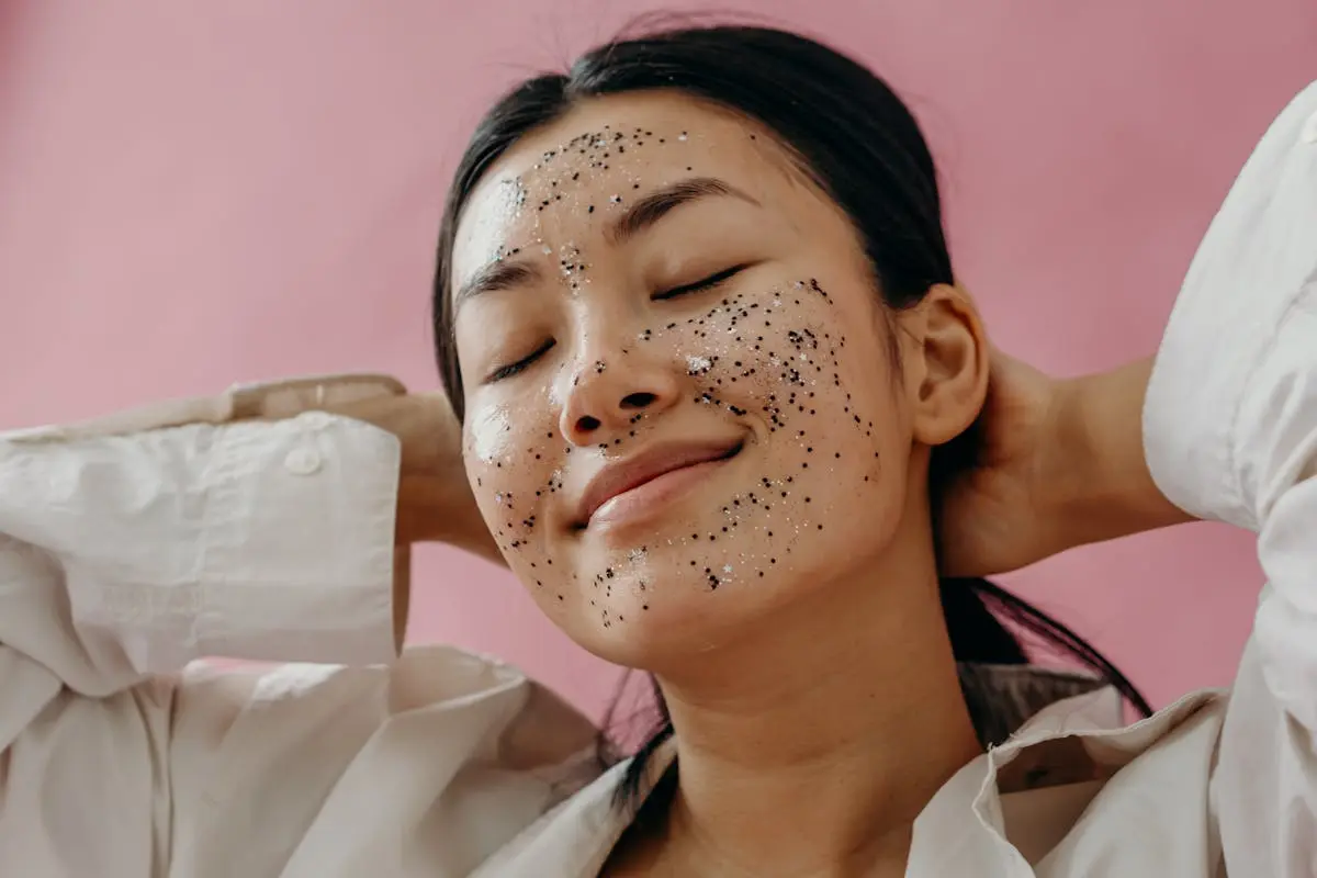 A Woman in White Long Sleeves Smiling with Glitters on Her Face