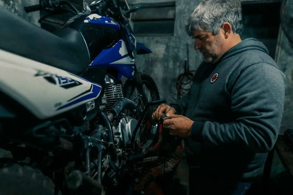 A man working on a motorcycle in a garage