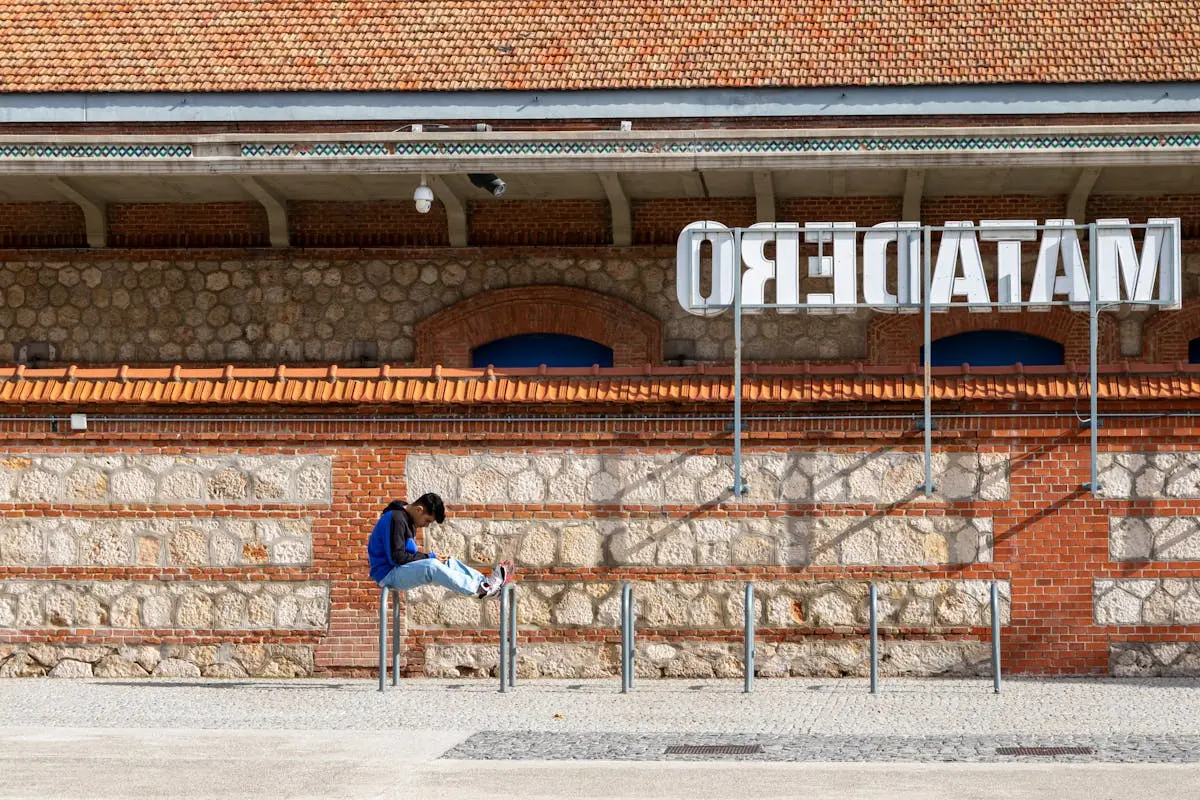 A person relaxing outside Matadero, an arts center in Madrid, Spain.