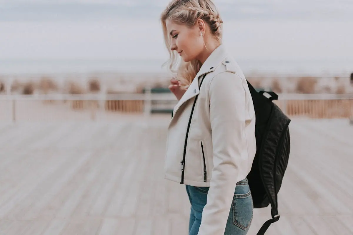 Woman in Black Zip-up Jacket With the lightest laptop backpack