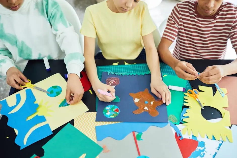 Kids enjoy crafting activities using paper and glue in a creative indoor workshop setting.