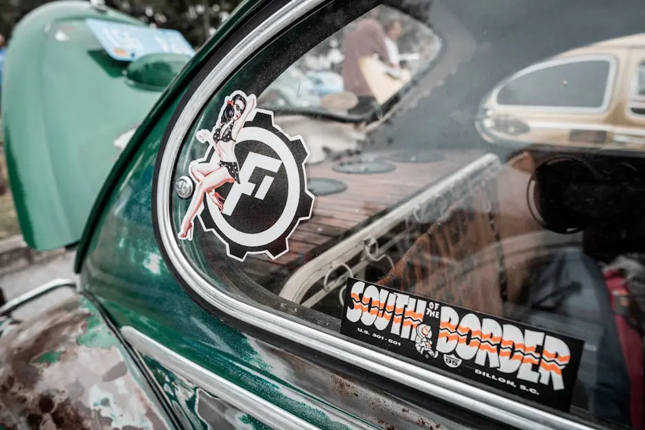 Close-up of a vintage Volkswagen Beetle showcasing retro stickers and classic car details.