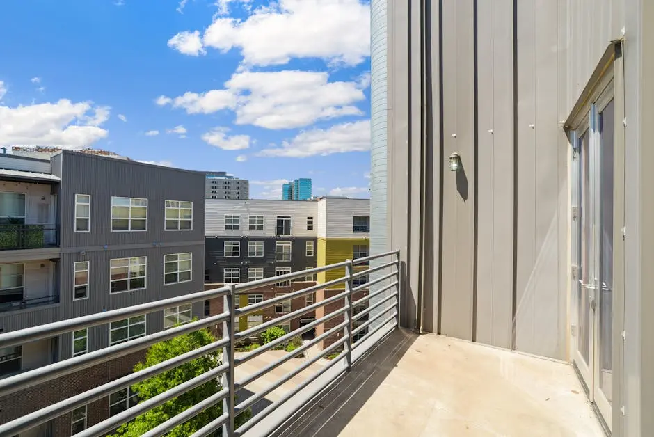 Bright and sunny view of modern urban apartments from a balcony.