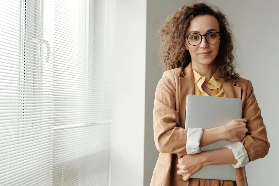 Woman Holding a Laptop