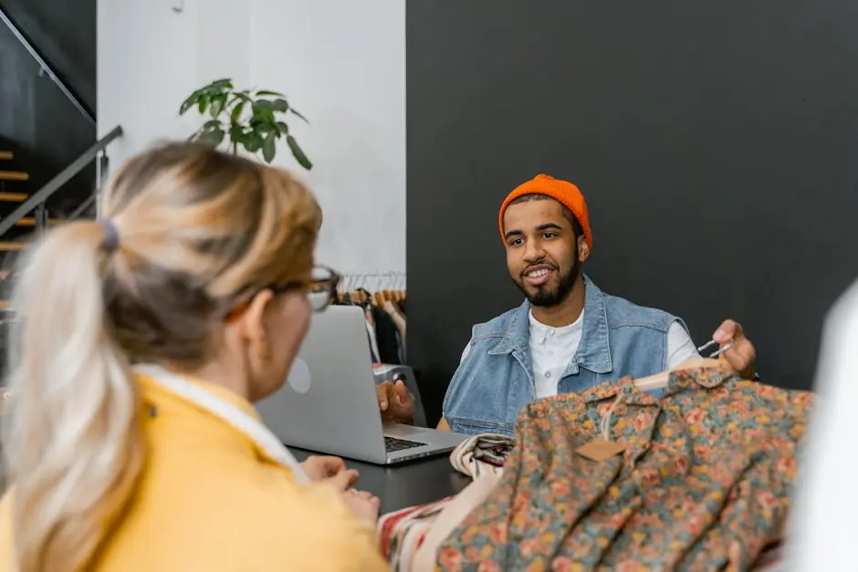 A friendly conversation between a customer and a boutique worker in a stylish shop setting.