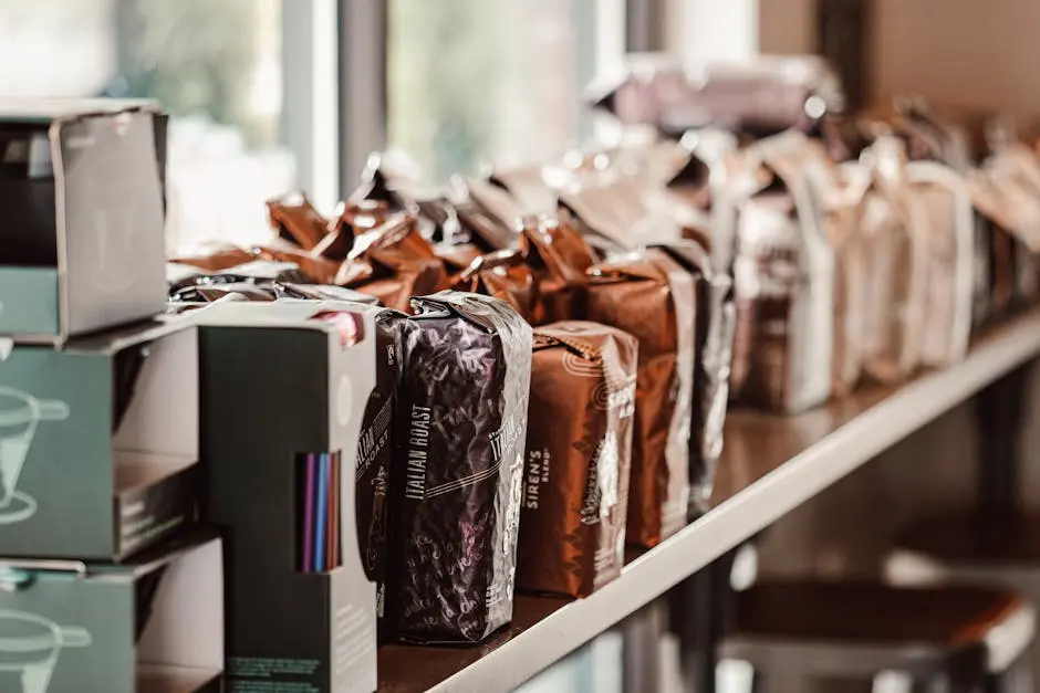 A variety of coffee bags neatly arranged on a shelf in an inviting café.