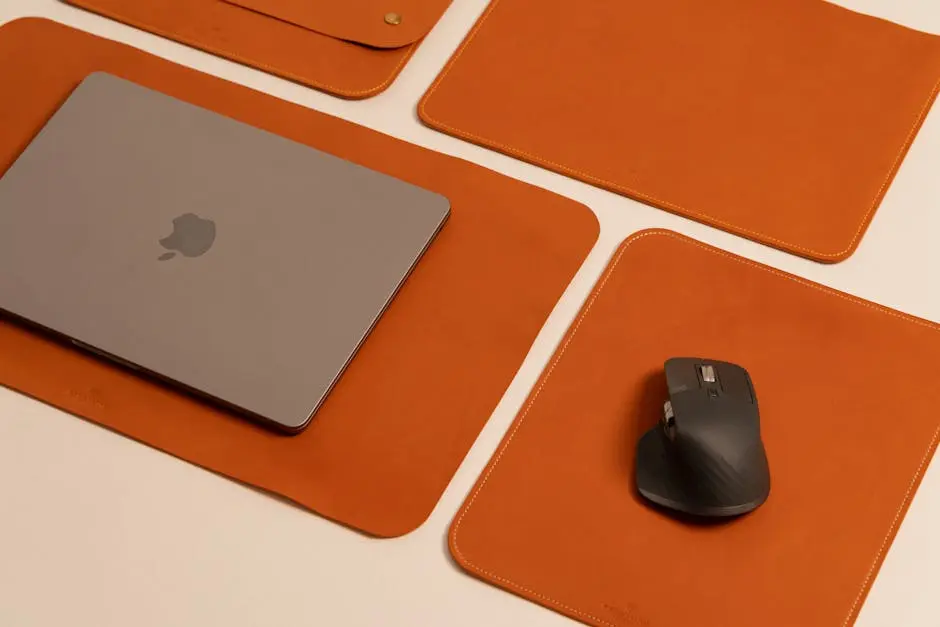 A mouse pad, mouse and keyboard are placed on a table