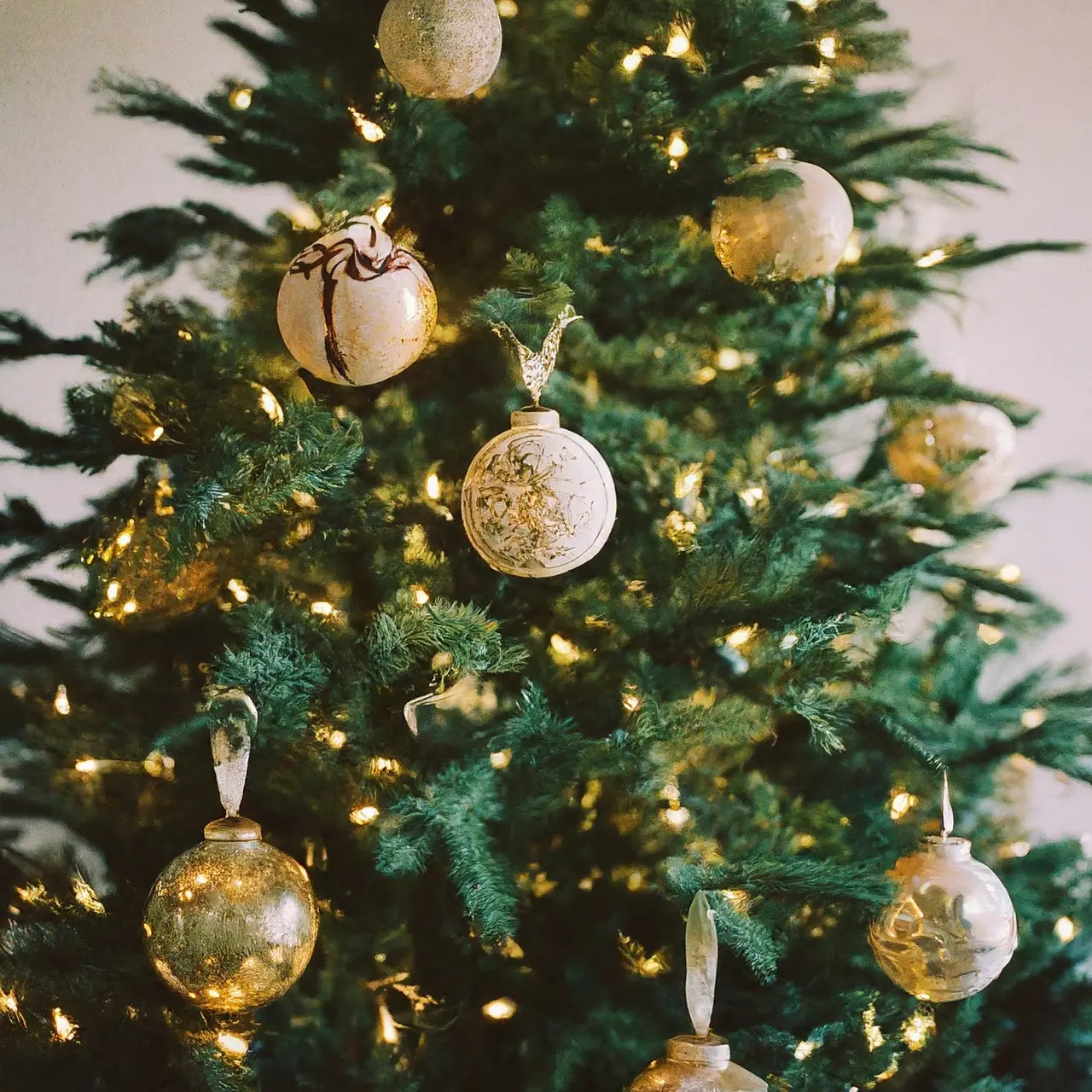 A beautifully decorated Christmas tree with elegant ornaments and lights. 35mm stock photo