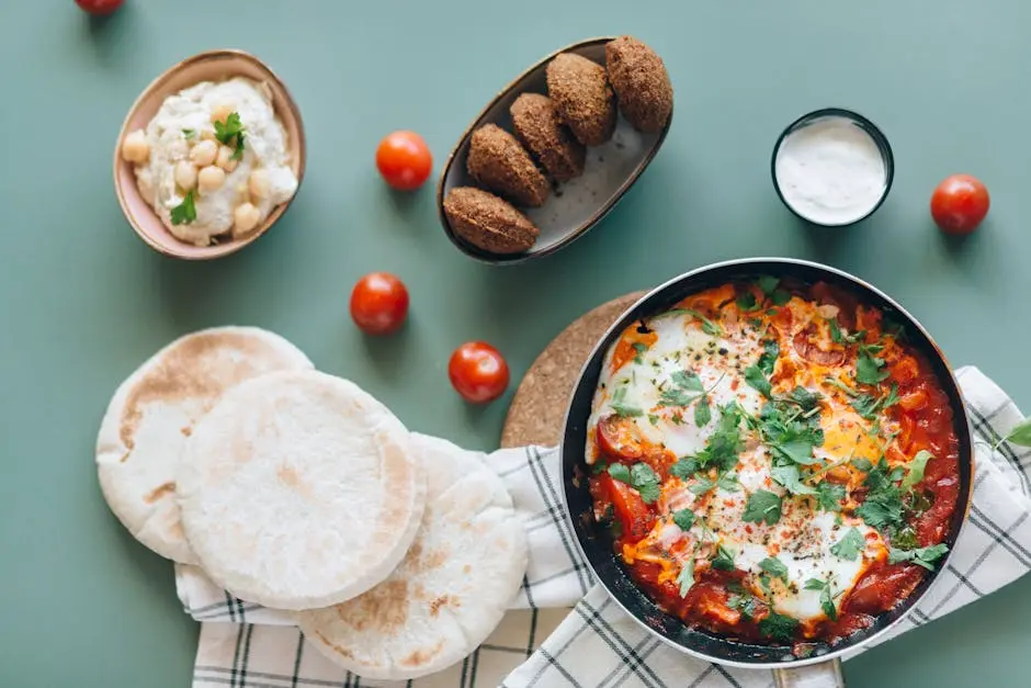 Shakshouka, Falafel, Hummus and Pita Breads on the Table