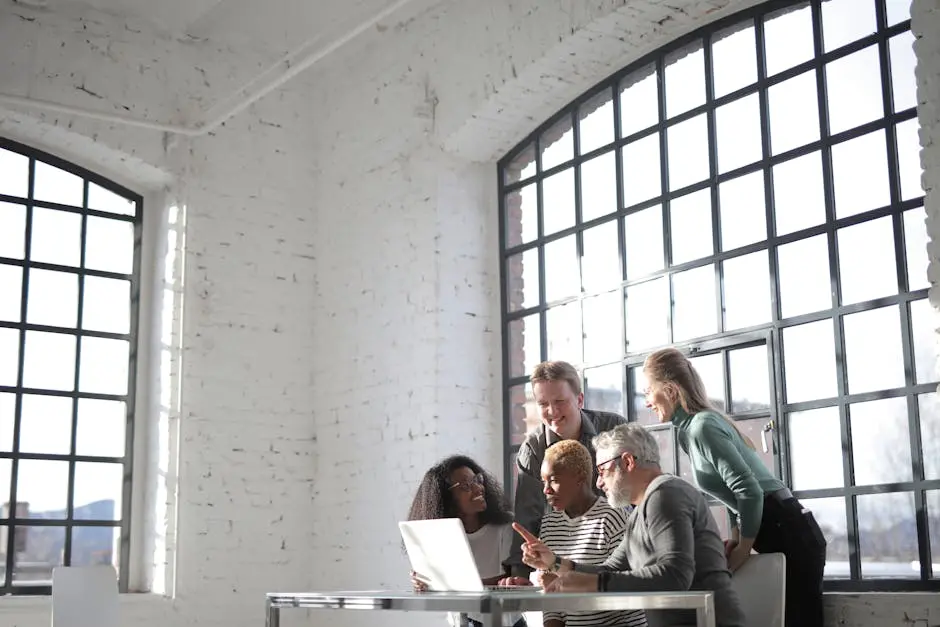 Group of coworkers discussing project in modern workplace