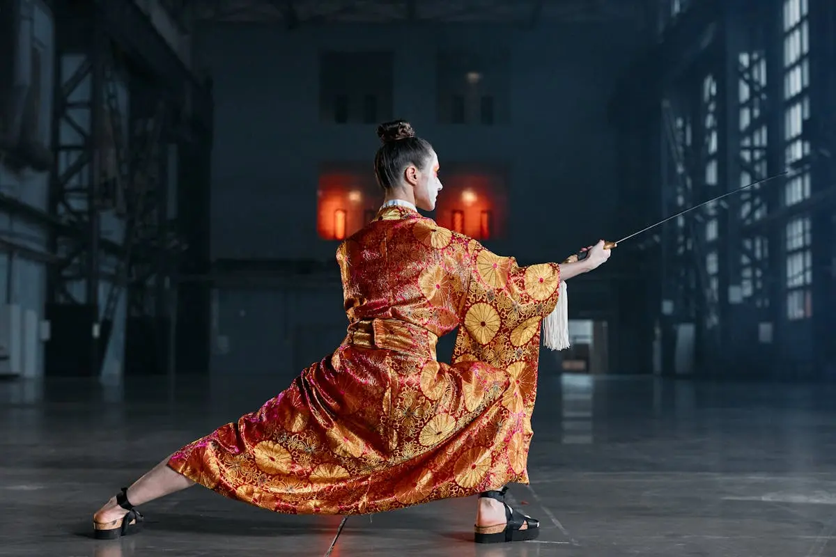 A Woman in a Kimono Holding a Sword