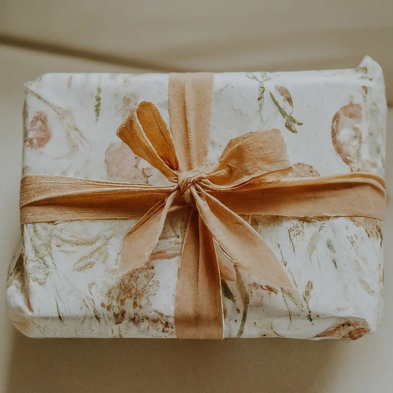 A beautifully wrapped bridal shower gift with a bow. 35mm stock photo