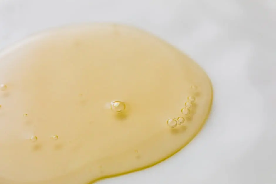 Transparent yellowish liquid on white surface