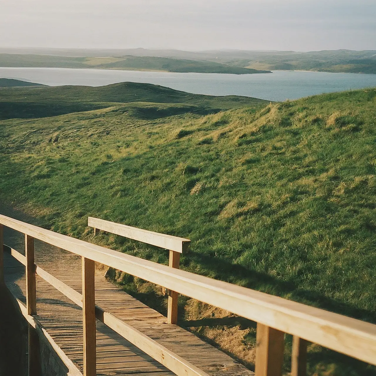 Wheelchair ramp with scenic travel destination in background. 35mm stock photo