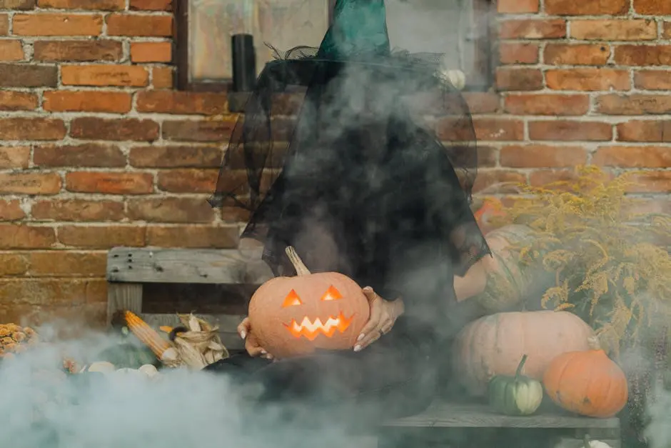 Mysterious witch holding a glowing Jack-O’-Lantern in a smoky, festive Halloween setting.