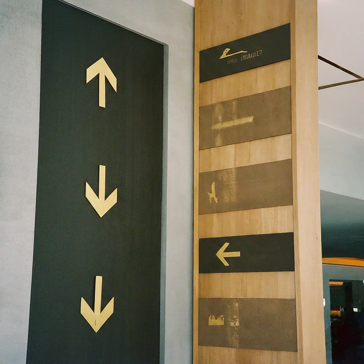 Directional signs in a modern hotel lobby. 35mm stock photo