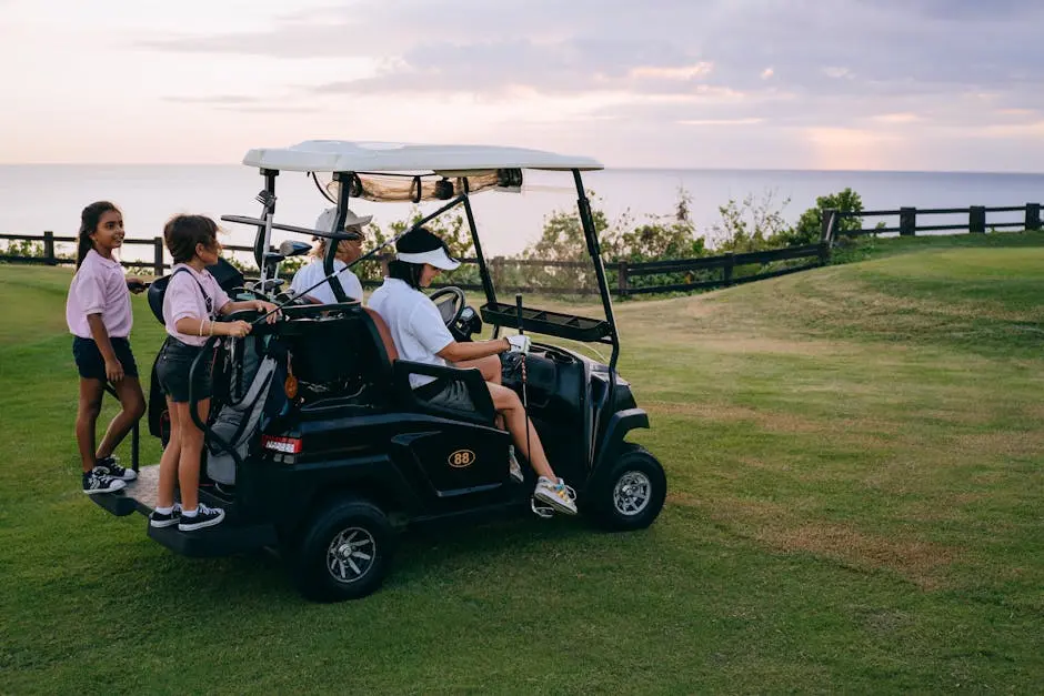 Family riding a golf cart across the golf course, enjoying leisure time together at sunset.