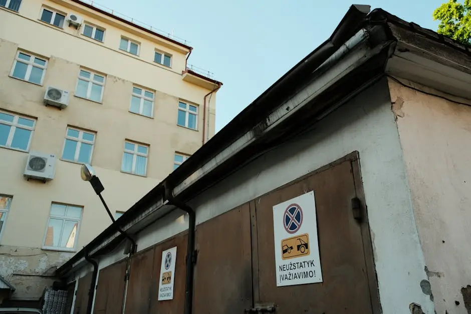 Doors of Garage near Block of Flats