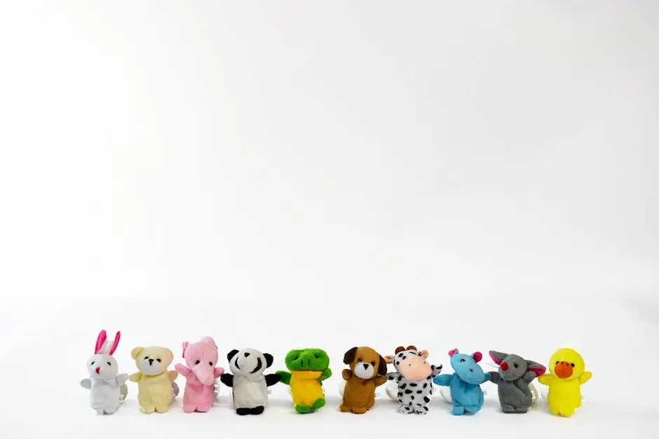 A diverse collection of colorful plush stuffed animals lined up on a white background.