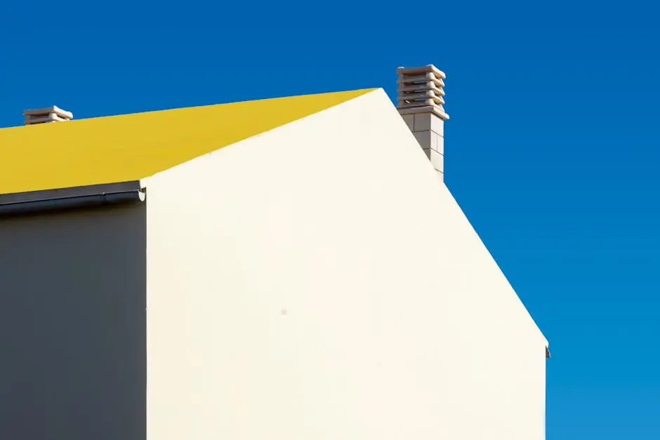 A yellow roof with a chimney on top