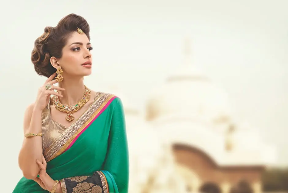 Portrait of a woman in traditional attire with intricate jewelry against a blurred background.