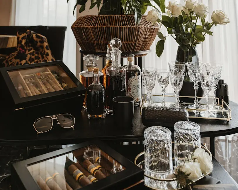 Boxes of Cigars Set on Table Surrounded by Glassware