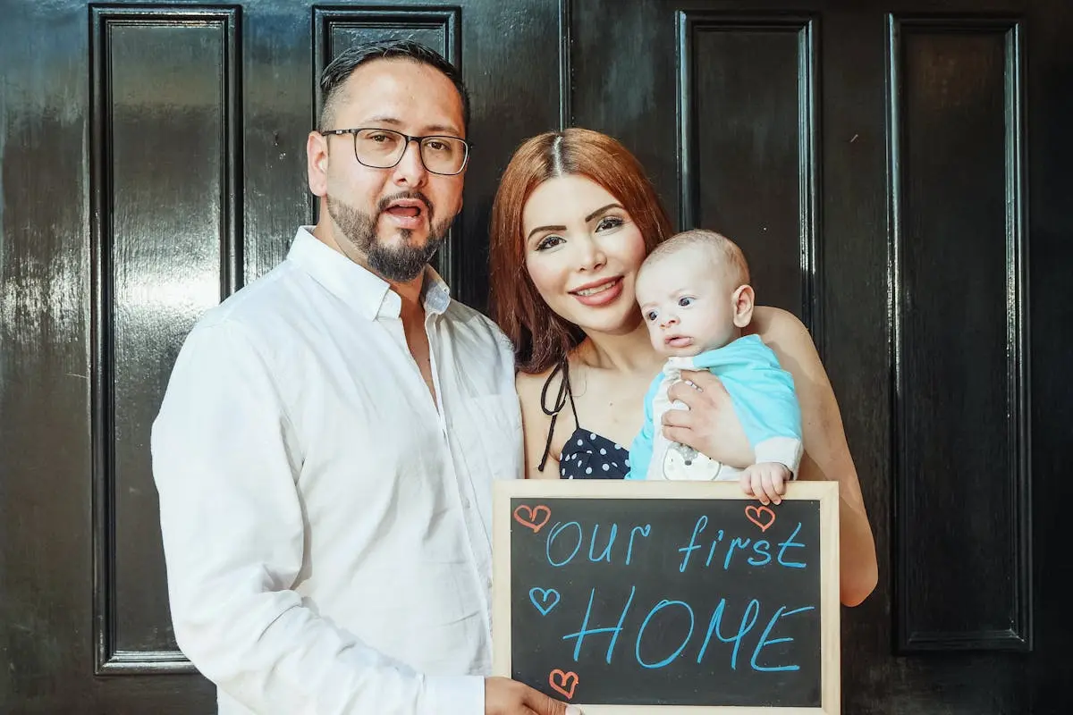 Man in White Dress Shirt Holding Girl in White Dress