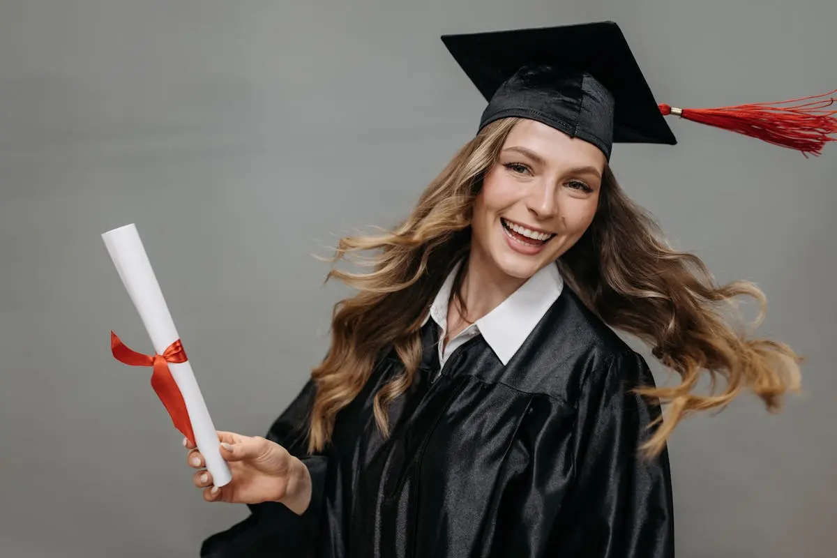 Photo of Happy Woman Holding Diploma