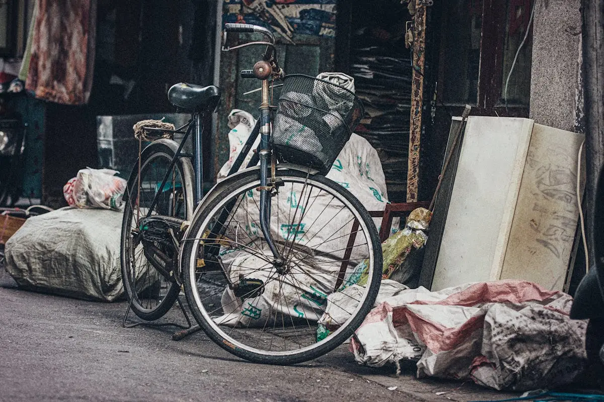 Black Commuter Bike Beside Trash