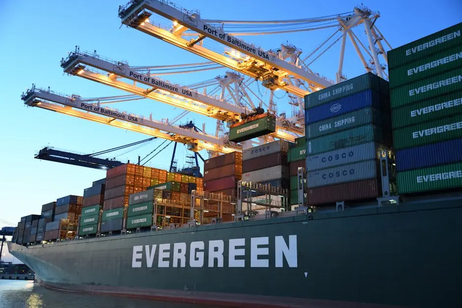 An Evergreen container ship loading at the Port of Baltimore during daytime.