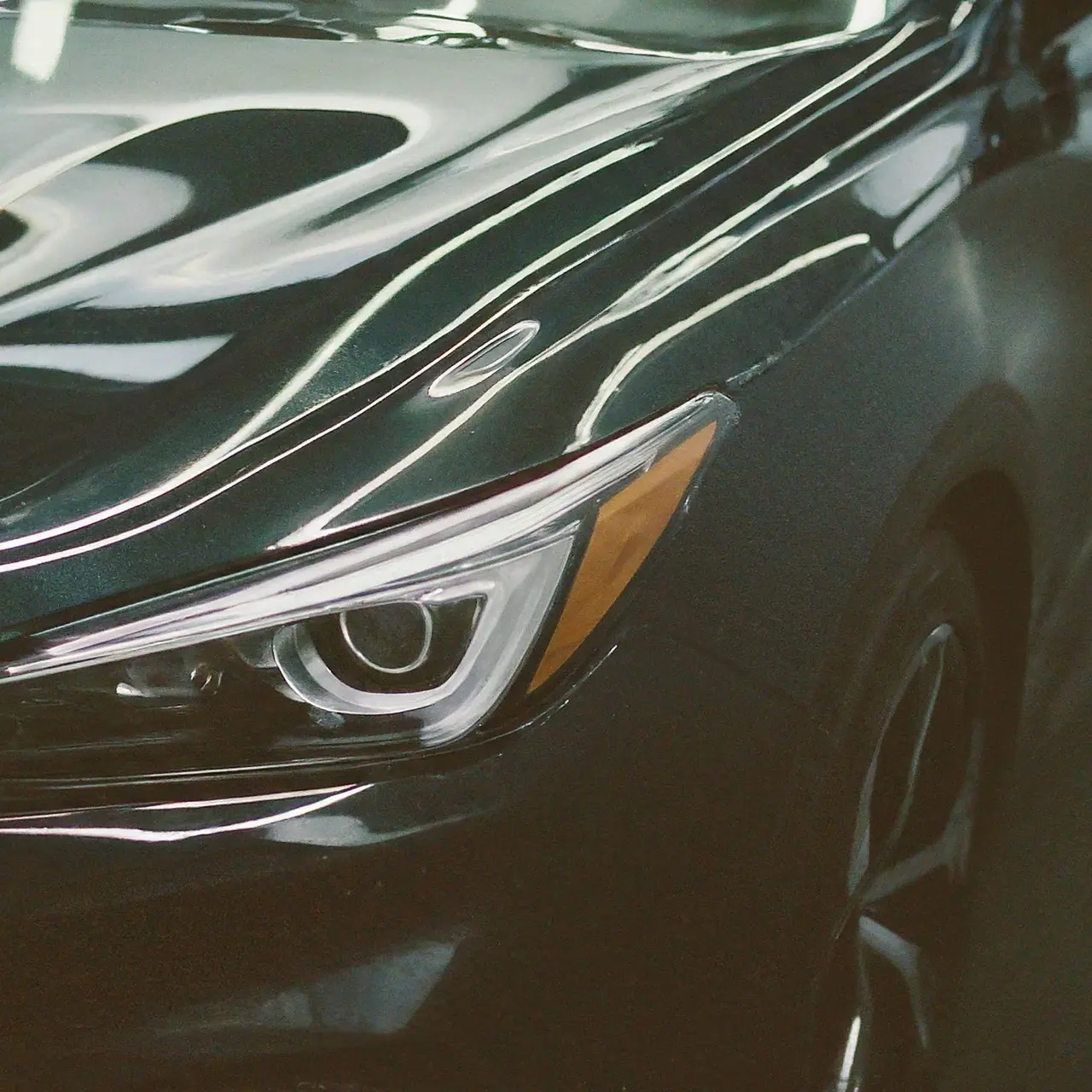 A shiny car with a reflective ceramic coating finish. 35mm stock photo